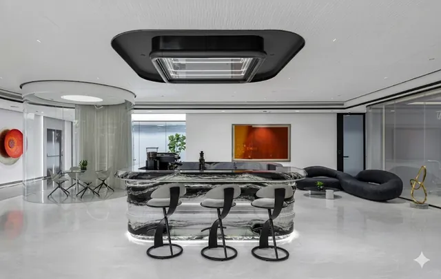 Breakout lounge with a stone-topped bar and sculpted seating